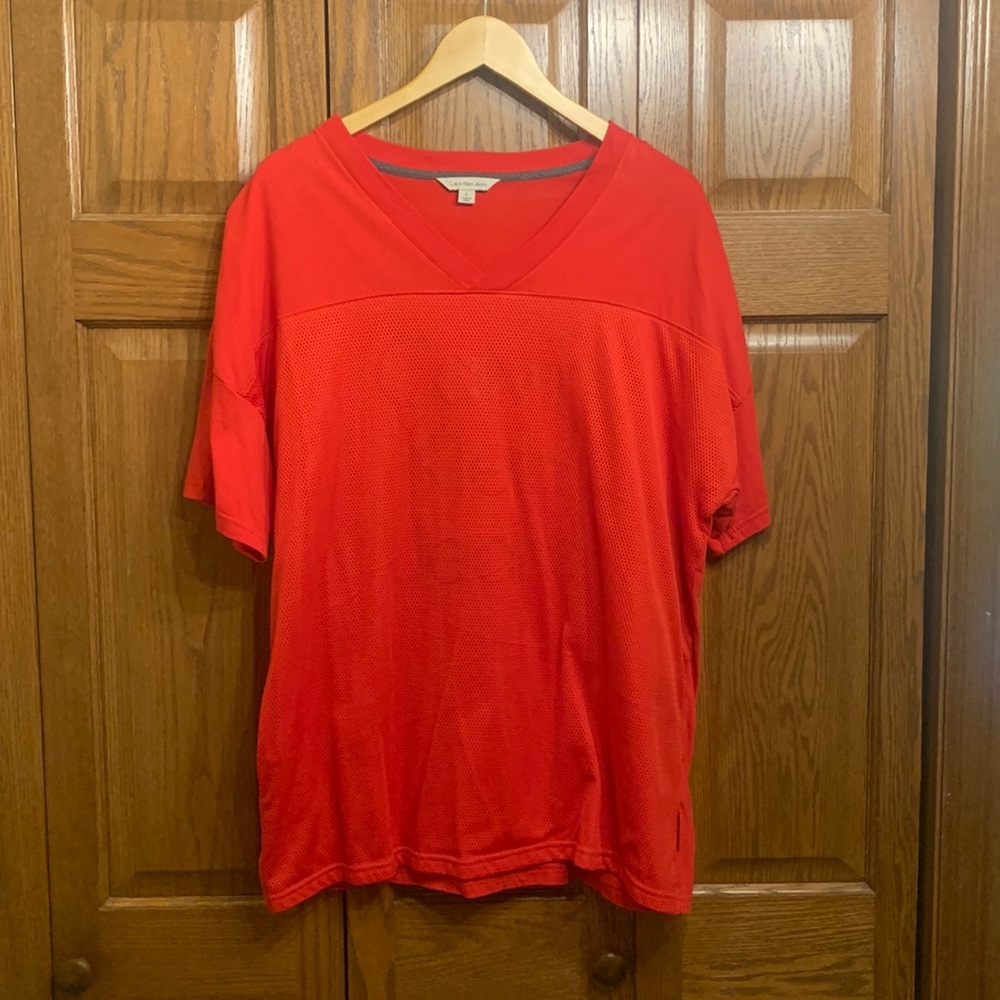 Mens red Calvin Klein T-shirt with mesh overlay.  Size Large